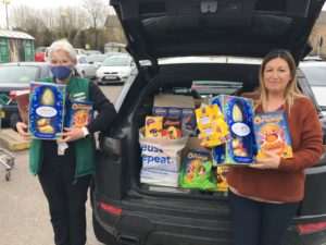 Katharine Smith and Andrena Carden-White pictured with a car boot full of easter eggs